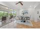 Bright dining area with sliding glass doors leading to a screened lanai and waterfront view at 715 45Th Ne Ave, St Petersburg, FL 33703