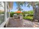 Paver patio with a built-in outdoor kitchen, featuring a grill, sink, and prep area, perfect for outdoor entertaining at 715 45Th Ne Ave, St Petersburg, FL 33703
