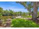 Picturesque waterfront view with a dock and boat lift surrounded by verdant landscaping at 715 45Th Ne Ave, St Petersburg, FL 33703