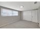 This spacious bedroom features gray carpet, fresh neutral paint, and a large closet for ample storage at 7411 Seashore Dr, Port Richey, FL 34668