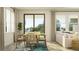 Bright dining area with a modern table, chairs, and sliding glass doors at 7528 E 116Th St, Palmetto, FL 34221