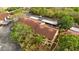 Aerial view of condominium buildings featuring covered parking, mature trees, and well-maintained landscaping at 7741 Forest Trl # 6, Port Richey, FL 34668