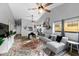 Bright living room with a large sectional sofa, colorful rug, and stylish decor accents at 7741 Forest Trl # 6, Port Richey, FL 34668