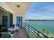 Enjoy bay views from this relaxing balcony with seating and coastal charm at 7932 Sailboat Key S Blvd # 506, South Pasadena, FL 33707