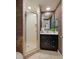 Bathroom features a single vanity with a framed mirror and a walk in shower at 7932 Sailboat Key S Blvd # 506, South Pasadena, FL 33707