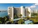Exterior of a condo building with a beautiful waterfront view at 7932 Sailboat Key S Blvd # 506, South Pasadena, FL 33707
