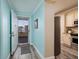 Bright foyer with an open door leading to a balcony and a glimpse of the kitchen at 7932 Sailboat Key S Blvd # 506, South Pasadena, FL 33707