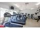 Bright gym interior with cardio equipment and a large window offering views at 7932 Sailboat Key S Blvd # 506, South Pasadena, FL 33707