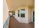 Exterior hallway with railing and multiple condo entrances at 7932 Sailboat Key S Blvd # 506, South Pasadena, FL 33707