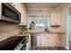 Updated kitchen features granite countertops, a stylish backsplash, and modern appliances at 7932 Sailboat Key S Blvd # 506, South Pasadena, FL 33707