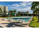 Shuffleboard courts surrounded by landscaping with residential buildings in the background at 7932 Sailboat Key S Blvd # 506, South Pasadena, FL 33707