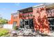 Red brick two-story exterior with an enclosed porch and screen door at 8220 12Th N Way # G, St Petersburg, FL 33702