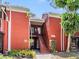 Condo with red brick and covered entrance, leading to the upper and lower level units at 8220 12Th N Way # G, St Petersburg, FL 33702