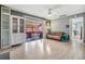 Sunlit living room with wood floors and sliding glass doors to a covered patio at 8220 12Th N Way # G, St Petersburg, FL 33702