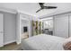 Bright bedroom featuring a queen bed, built-in shelving, and closet for ample storage at 8226 W Gulf Blvd # 2, Treasure Island, FL 33706