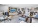 Open living area with a tv, bar area and views to the dining room and kitchen at 8226 W Gulf Blvd # 2, Treasure Island, FL 33706
