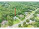 Scenic aerial perspective of home, nestled within lush greenery, highlighting its serene setting at 8444 Shenandoah Run, Wesley Chapel, FL 33544