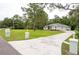 Lovely single story home featuring a manicured lawn, mature trees, and inviting curb appeal at 8444 Shenandoah Run, Wesley Chapel, FL 33544