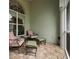 Cozy screened patio featuring comfortable seating and space for relaxation at 8444 Shenandoah Run, Wesley Chapel, FL 33544