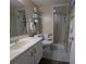 Well-lit bathroom with a glass shower, sink, and neutral wall coloring at 8765 Bardmoor Blvd # 108, Seminole, FL 33777