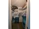 Walk-in closet filled with organizational shelving for ample storage at 8765 Bardmoor Blvd # 108, Seminole, FL 33777