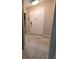Condo entryway with tiled floor, white front door and decor at 8765 Bardmoor Blvd # 108, Seminole, FL 33777