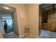 Condo hallway with tiled floor leading to living area and kitchen at 8765 Bardmoor Blvd # 108, Seminole, FL 33777