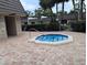 Community Jacuzzi with steps leading up to the clear water for relaxing at 8765 Bardmoor Blvd # 108, Seminole, FL 33777