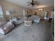 Comfortable living area featuring neutral walls, plush furniture, and a round table at 8765 Bardmoor Blvd # 108, Seminole, FL 33777