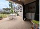 Comfortable patio with views and storage featuring a washer and dryer at 8765 Bardmoor Blvd # 108, Seminole, FL 33777