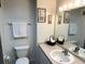 Bright bathroom featuring a modern sink, framed art, and a towel rack at 880 Mandalay Ave # C1103, Clearwater Beach, FL 33767
