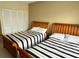 Bedroom featuring two twin beds and a closet at 880 Mandalay Ave # C1103, Clearwater Beach, FL 33767