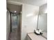 Hallway with closet and vanity with sink at 880 Mandalay Ave # C1103, Clearwater Beach, FL 33767