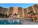 Exterior shot of a large pool outside of the condominium building at 880 Mandalay Ave # C1103, Clearwater Beach, FL 33767