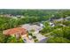 Aerial view of the residential neighborhood showcases mature trees, manicured landscaping and proximity to amenities at 9402 Woodbay Dr, Tampa, FL 33626