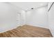This bedroom boasts durable flooring, crisp white walls, and two entry doors at 9402 Woodbay Dr, Tampa, FL 33626