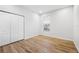 Bright bedroom with modern flooring and a closet provides a comfortable and stylish living space at 9402 Woodbay Dr, Tampa, FL 33626