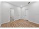 This bedroom includes wood-look flooring, and access to an en-suite bathroom at 9402 Woodbay Dr, Tampa, FL 33626