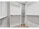 Spacious walk-in closet features custom shelving and ample storage space, perfect for organizing clothes and accessories at 9402 Woodbay Dr, Tampa, FL 33626