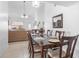 Bright dining room with vaulted ceilings, tile flooring, and an elegant chandelier for a delightful eating experience at 10213 Westport Ct, Tampa, FL 33615