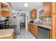 Well-lit kitchen featuring stainless steel appliances and ample counter space at 10213 Westport Ct, Tampa, FL 33615