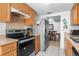 Functional kitchen with stainless steel appliances and a view of the dining area at 10213 Westport Ct, Tampa, FL 33615