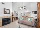 Open-concept room featuring a fireplace, comfortable seating, and neutral decor at 10213 Westport Ct, Tampa, FL 33615
