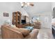 Open living room with tile flooring, neutral decor, lots of natural light, and a fireplace at 10213 Westport Ct, Tampa, FL 33615