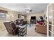 Comfortable living room with ceiling fan and access to the exterior, providing an inviting space to relax and unwind at 10213 Westport Ct, Tampa, FL 33615