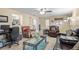 Inviting living room with tile flooring, ceiling fan, and seamless flow to other rooms for easy entertaining and living at 10213 Westport Ct, Tampa, FL 33615