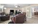 Spacious living room with tile flooring and access to the dining room and kitchen, perfect for modern living at 10213 Westport Ct, Tampa, FL 33615