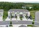 Aerial shot of townhomes with attached garages and modern exteriors at 11054 Crescent Deer Dr, Land O Lakes, FL 34638