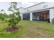 View of backyard with a screened in patio and newly installed lawn at 11054 Crescent Deer Dr, Land O Lakes, FL 34638