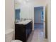 Bathroom featuring a double sink vanity with granite countertops and a tiled floor at 11054 Crescent Deer Dr, Land O Lakes, FL 34638